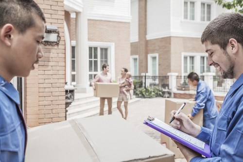 House removalists handling a move in an Earls Court residential street