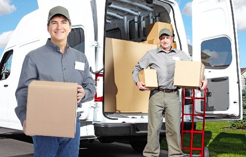 Packing boxes and furniture for a removals van in Earls Court
